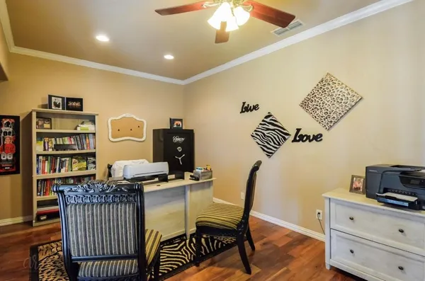 a view of a workspace with furniture