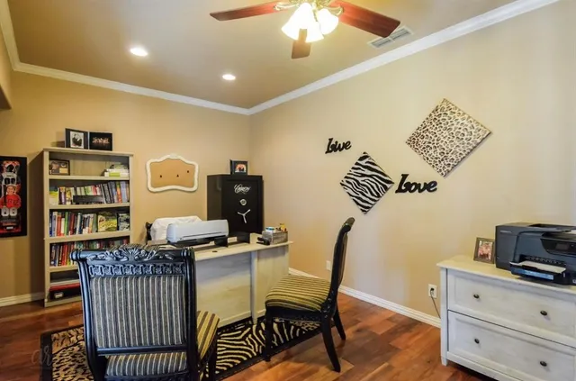 a view of a workspace with furniture