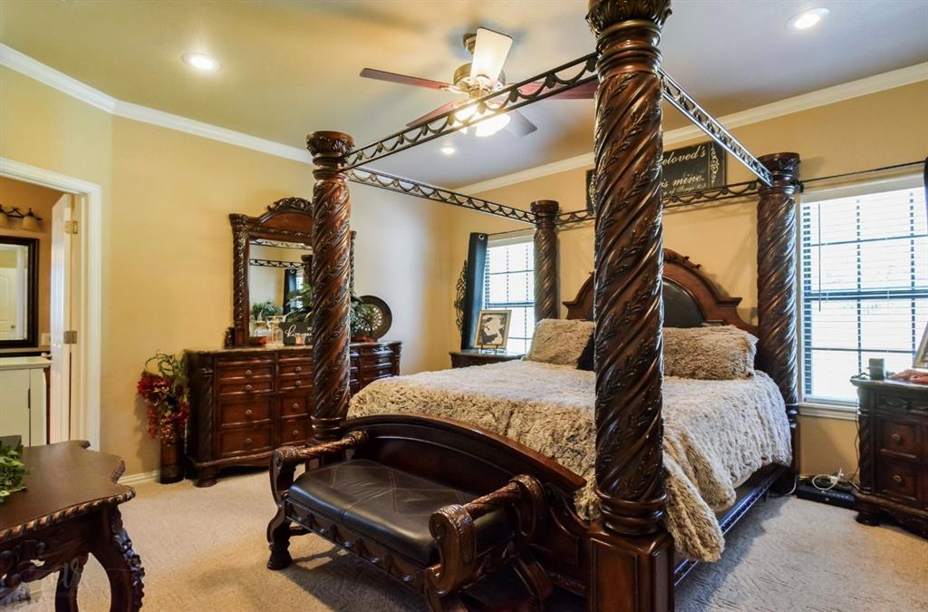 2457 Highway 83 Tuscola, TX 79562 - Photo 16 of 40 a bedroom with a bed gym equipment and a large window