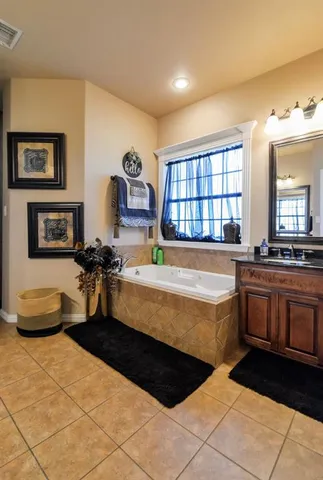 a large bedroom with a large bed and a large window