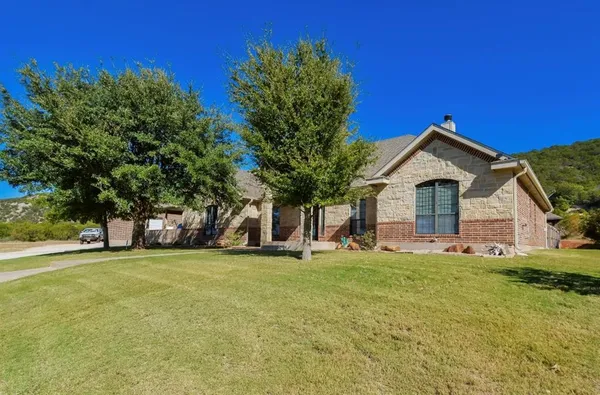 a view of a house with a yard