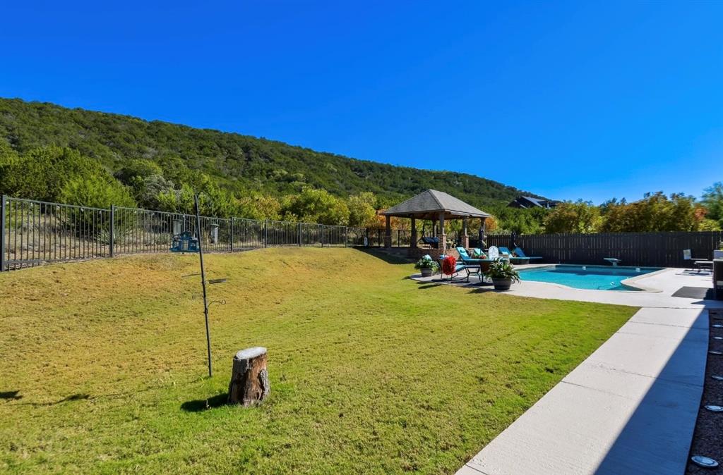 2457 Highway 83 Tuscola, TX 79562 - Photo 38 of 40 a view of a swimming pool with a table and chairs