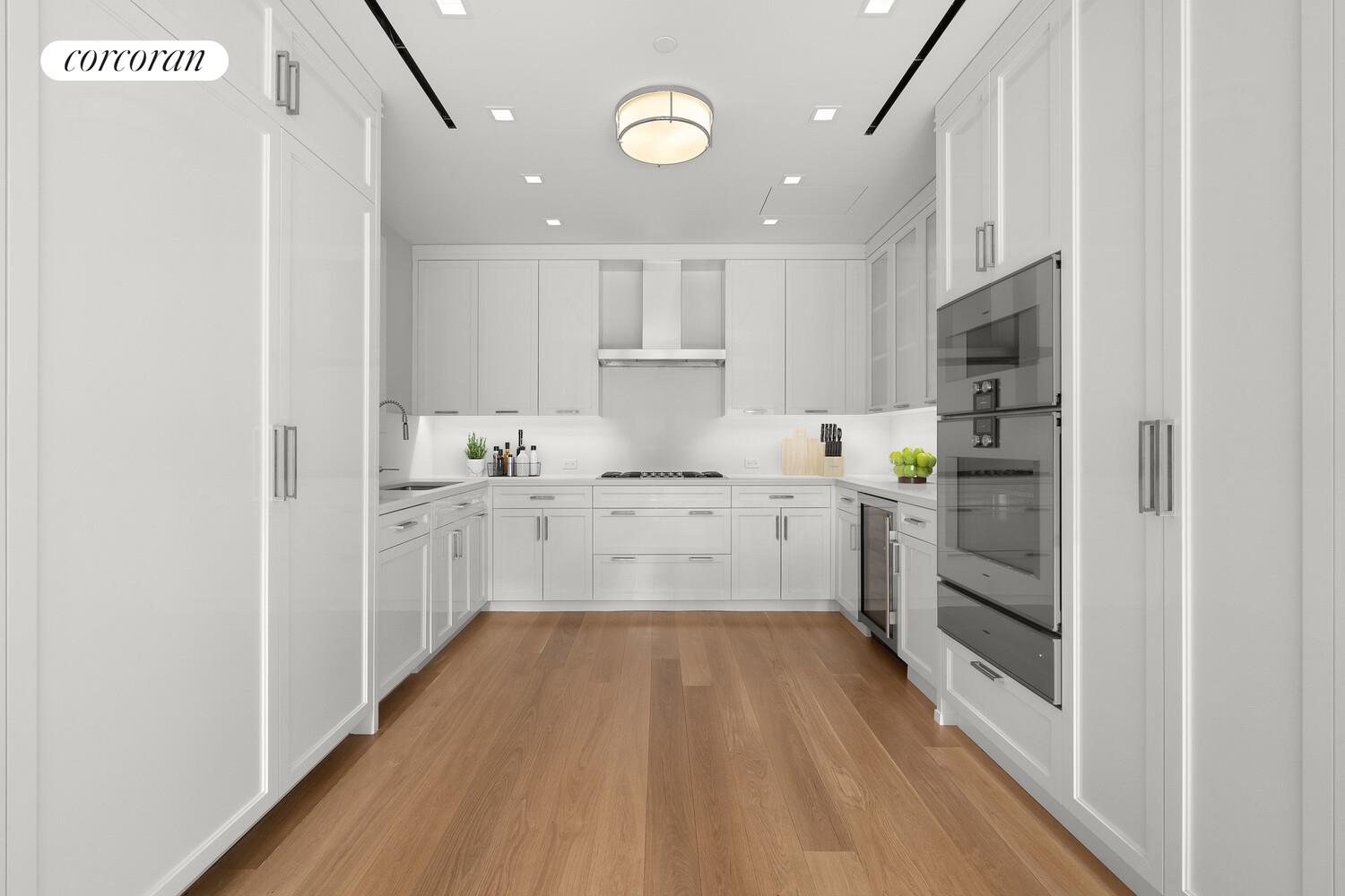 40 East 72nd Street, Unit MAIS Manhattan, NY 10021 - Photo 3 of 16 a kitchen with a refrigerator and white cabinets