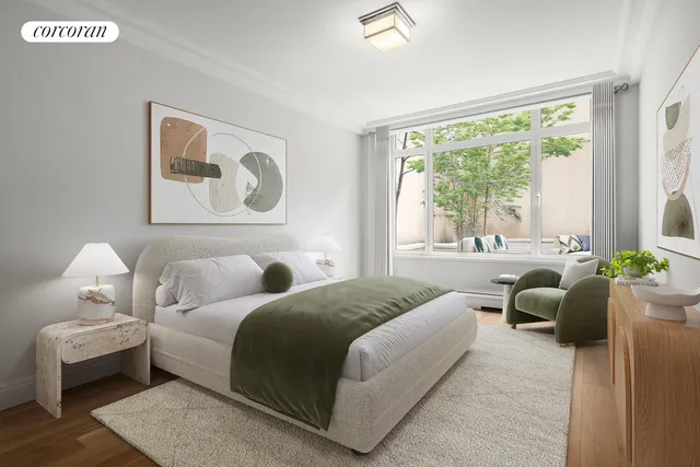 a bedroom with a large bed couch and a large window