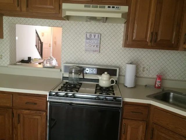 a kitchen with a stove and a microwave