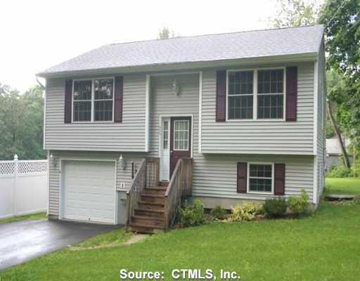 608 Old Post Road Tolland, CT 06084 - Photo 1 of 1 a front view of a house with a garden