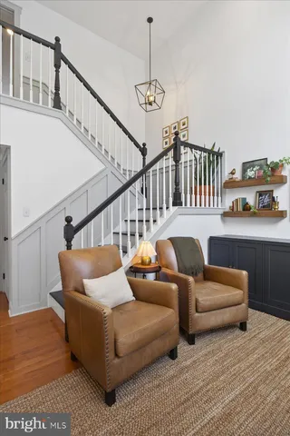 a balcony with furniture and wooden floor