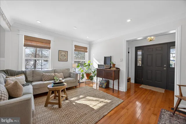 a living room with furniture and a rug