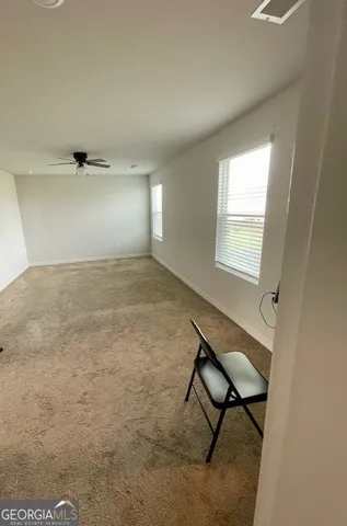 a view of an empty room and window