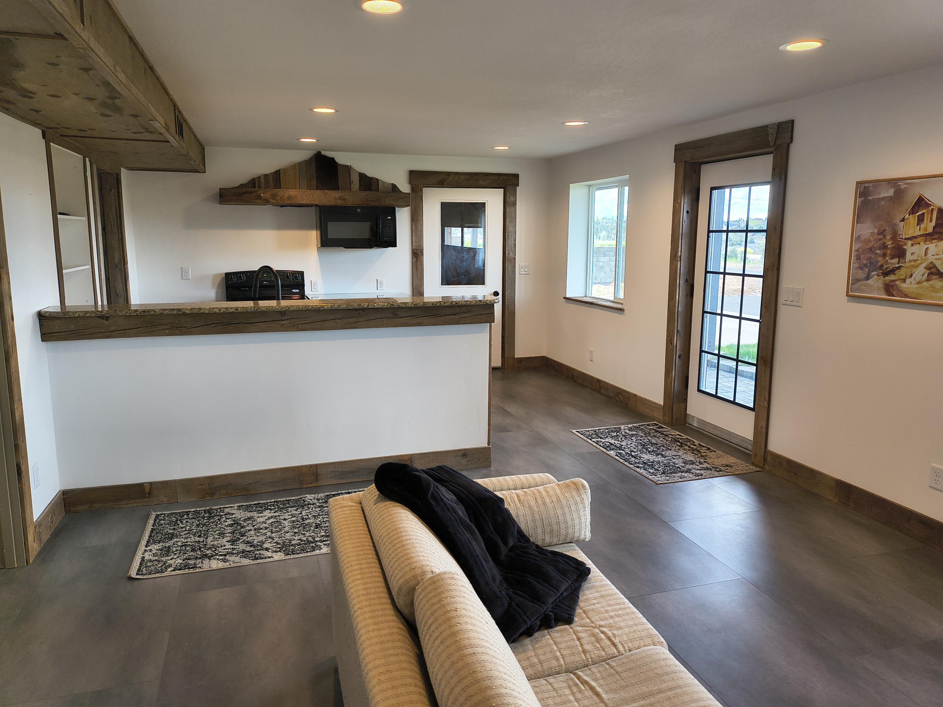 791 Southeast Grizzly Road Madras, OR 97741 - Photo 23 of 31 a living room with furniture and a window