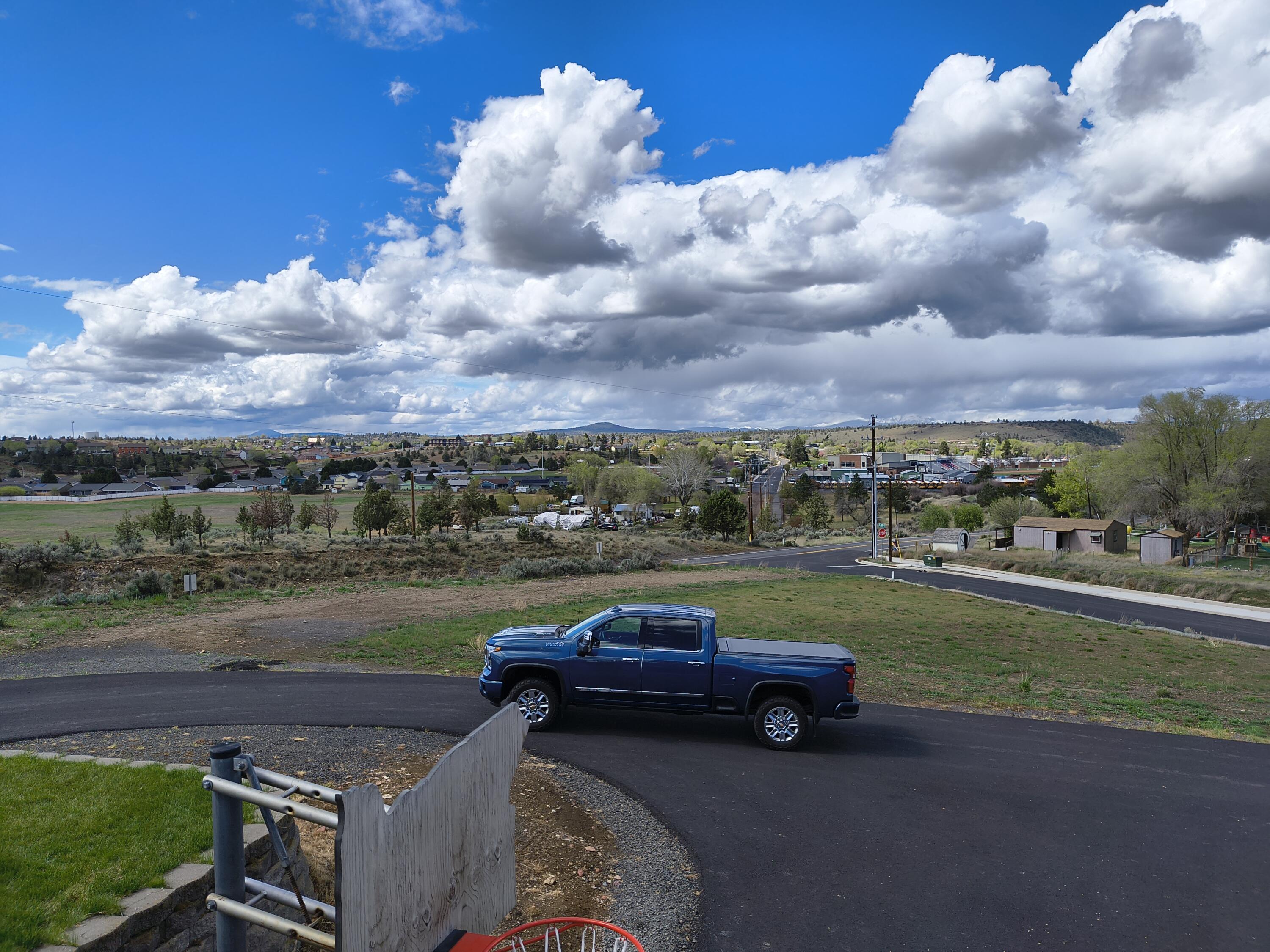 791 Southeast Grizzly Road Madras, OR 97741 - Photo 30 of 31 a view of a yard with cars parked