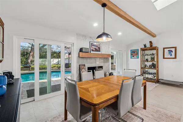 a kitchen with stainless steel appliances a stove a sink cabinets and a refrigerator