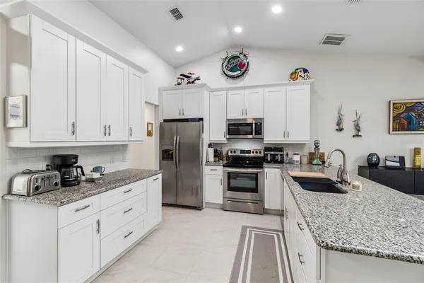 a living room with furniture a rug and a window