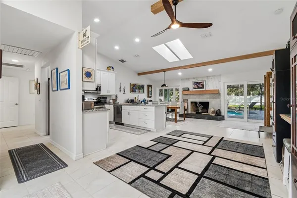 a kitchen with granite countertop a refrigerator and a stove