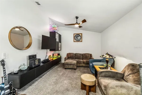 a spacious bathroom with a granite countertop sink mirror and shower