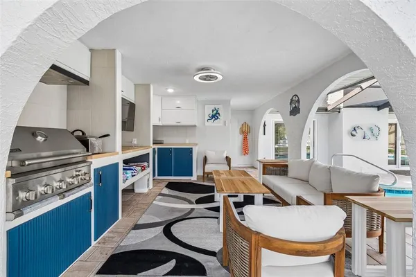 an aerial view of a house with a yard and lake view