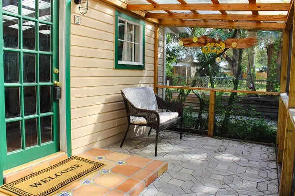 a view of a patio with a table and chairs