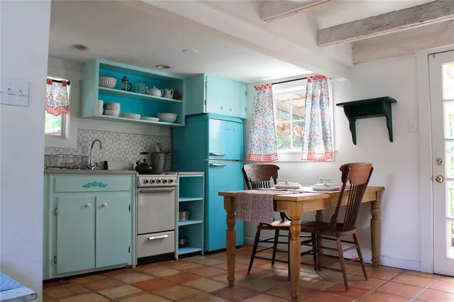 a view of a dining room with furniture and window