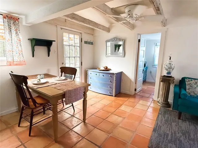 a view of a livingroom with furniture and window