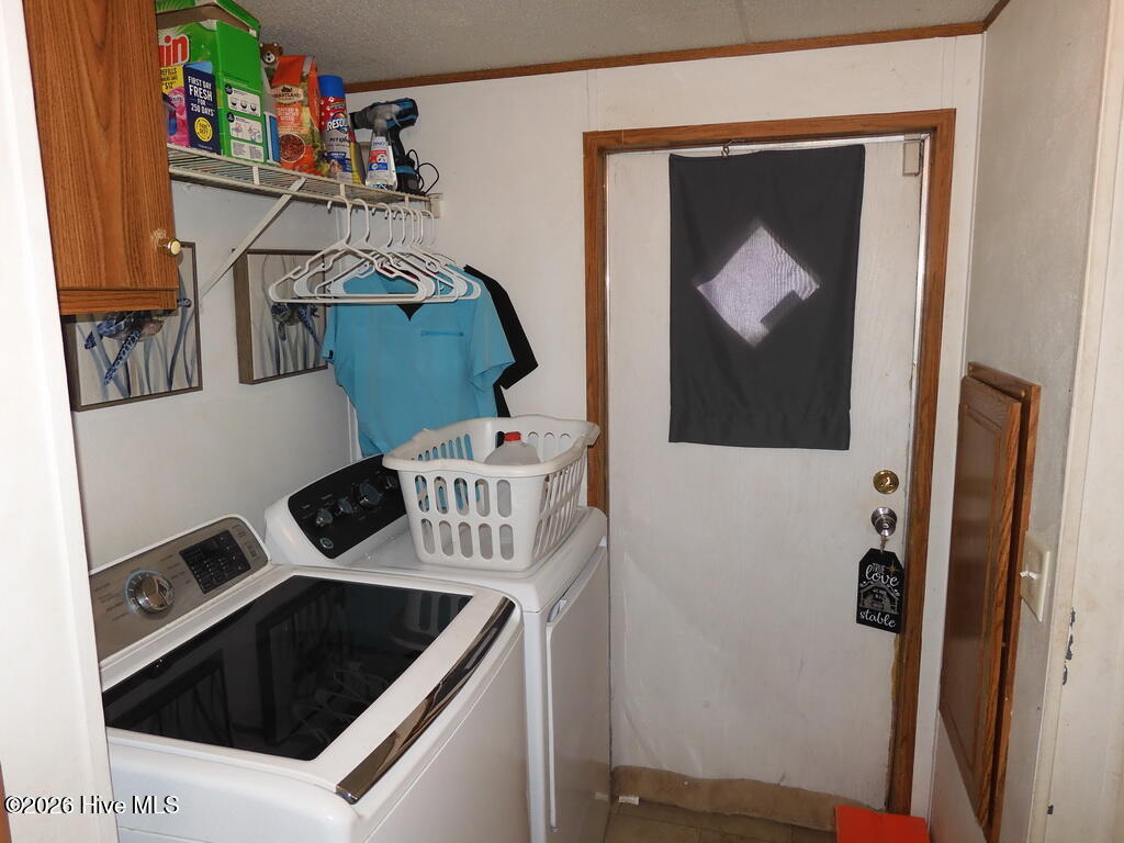 201 Duck Ridge Drive Pikeville, NC 27863 - Photo 13 of 30 LAUNDRY ROOM WITH STORAGE