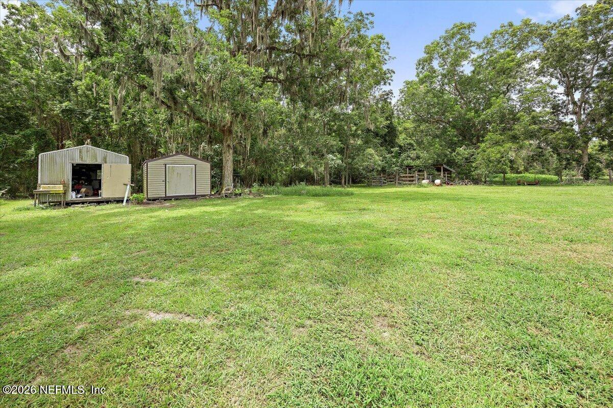 3476 Clifford Dugger Road Glen St. Mary, FL 32040 - Photo 21 of 30 21-Backyard with Storage Sheds
