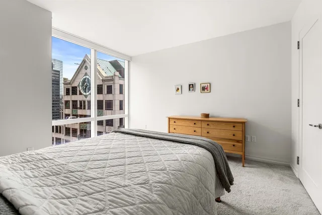 a bedroom with a bed and a cabinets