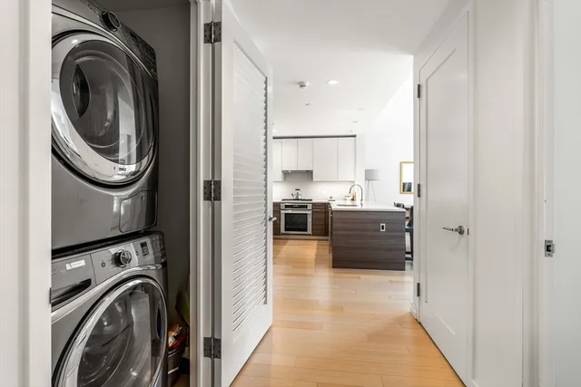 a view of a kitchen with a washer and dryer