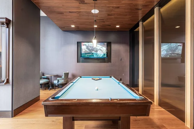 a room with furniture and air hockey table