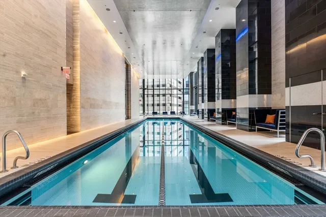 a view of a swimming pool with a balcony