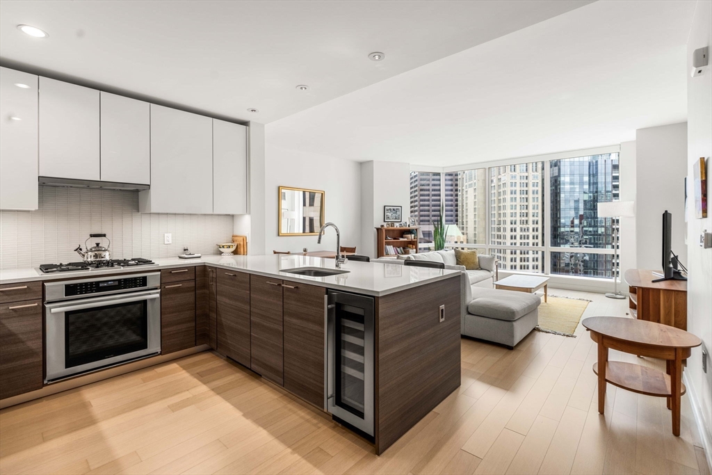1 Franklin Street, Unit 2609 Boston, MA 02110 - Photo 7 of 24 a kitchen with stainless steel appliances granite countertop a lot of counter space and a sink