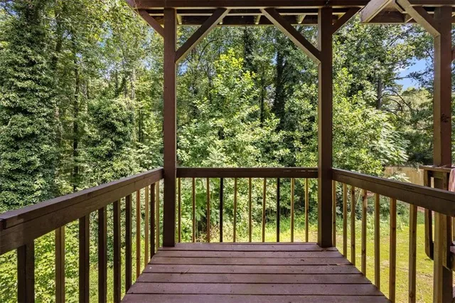 a view of balcony with wooden floor