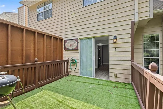 a view of a patio in back of a house