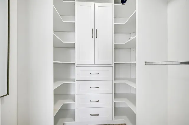 a view of an empty walk in closet