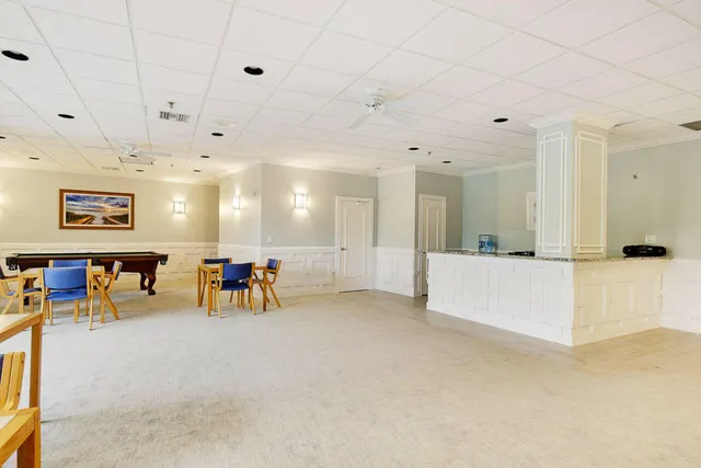 a view of a livingroom with furniture and a chandelier