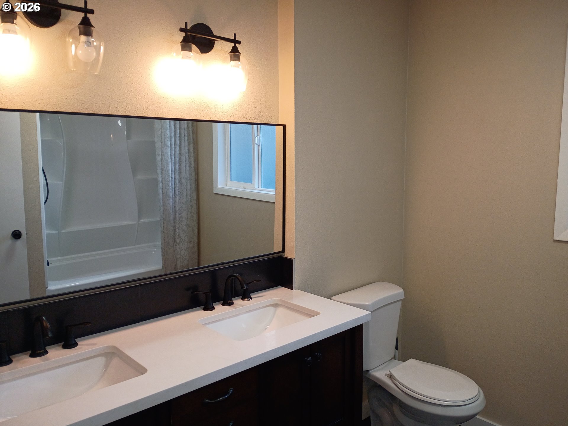 625 North Knights Bridge Road Canby, OR 97013 - Photo 12 of 18 a bathroom with a sink a toilet and mirror