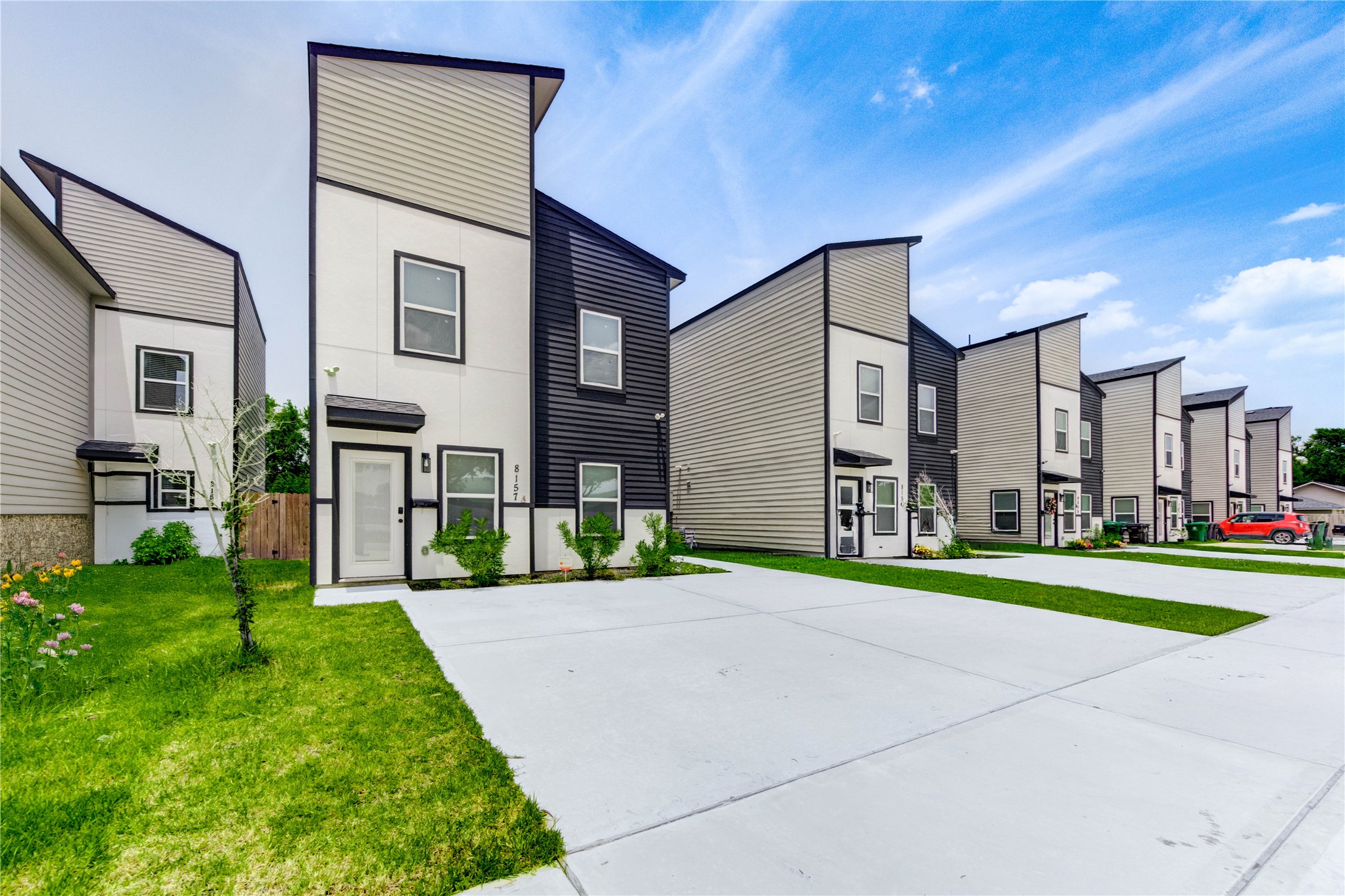 8157 Tate Street, Unit A Houston, TX 77028 - Photo 2 of 29 a front view of a house with a yard and trees
