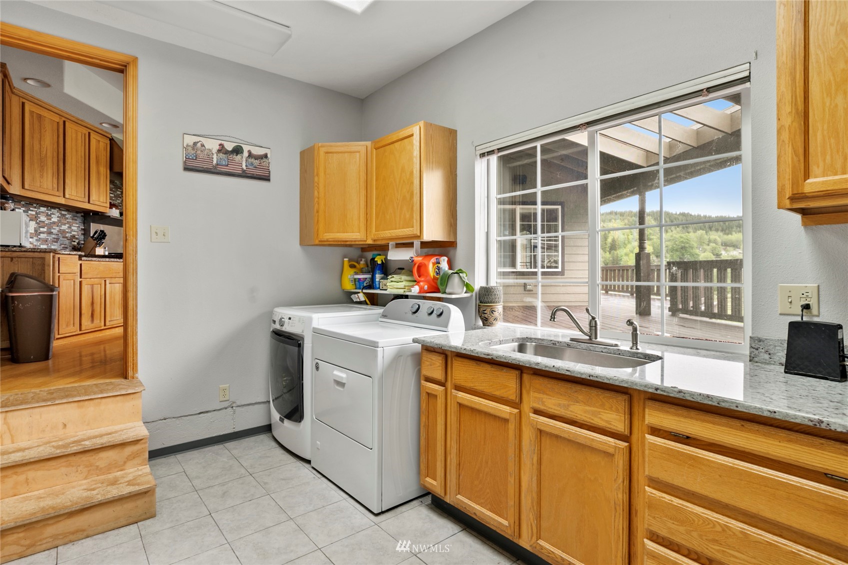 300 West Elk Ridge Road Shelton, WA 98584 - Photo 14 of 40 a kitchen with sink cabinets and window