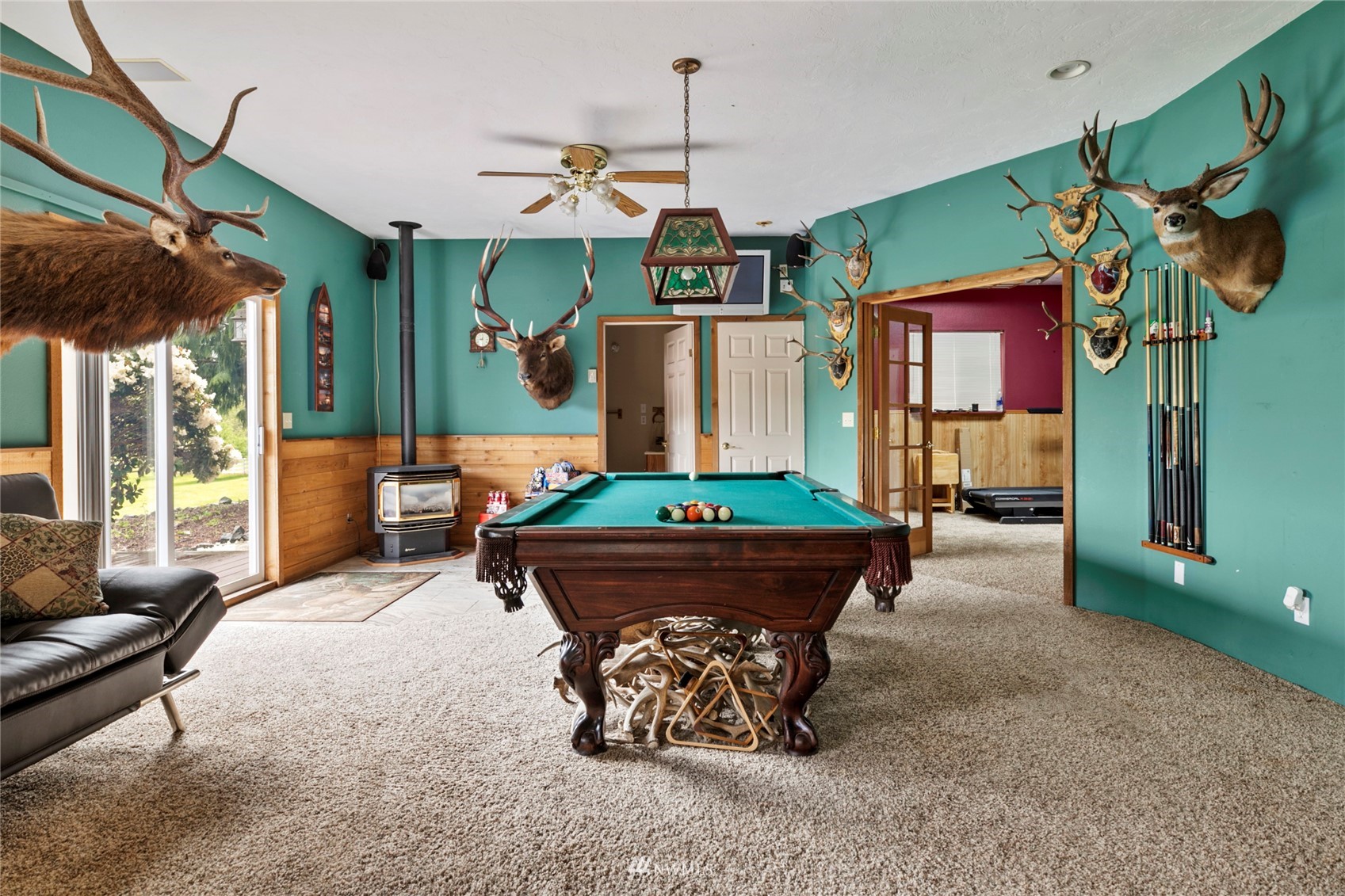 300 West Elk Ridge Road Shelton, WA 98584 - Photo 15 of 40 a living room with furniture and a chandelier