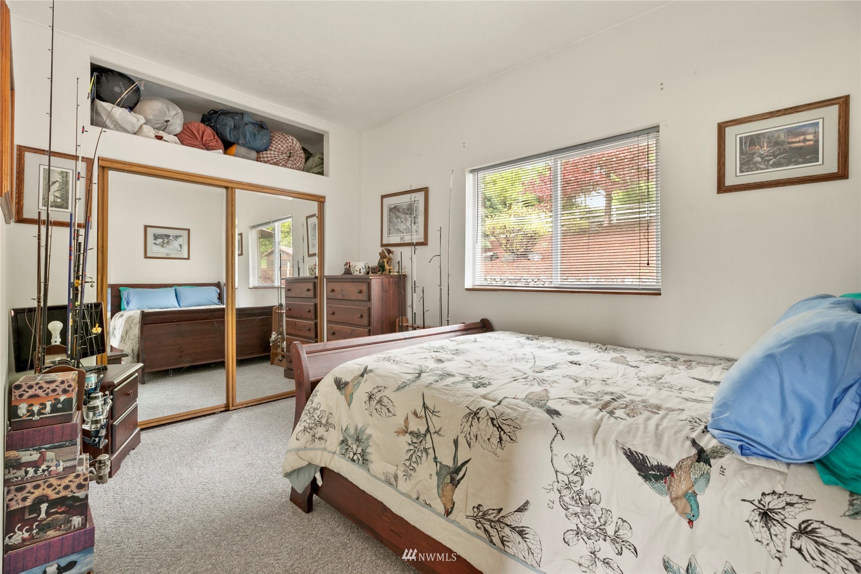 300 West Elk Ridge Road Shelton, WA 98584 - Photo 18 of 40 a spacious bedroom with a bed a couch and dresser