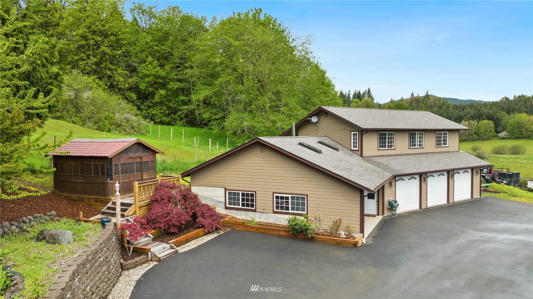 300 West Elk Ridge Road Shelton, WA 98584 - Photo 2 of 40 a view of a house with a yard and sitting area