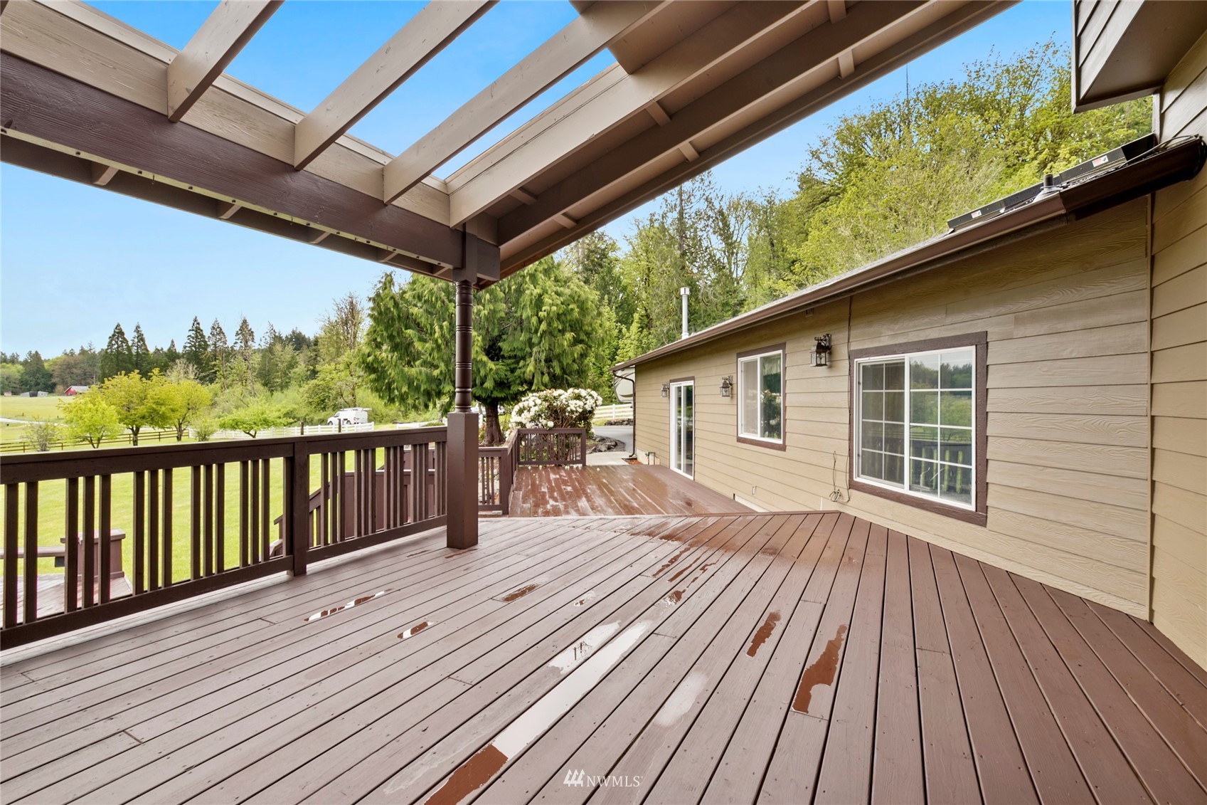 300 West Elk Ridge Road Shelton, WA 98584 - Photo 25 of 40 a view of a wooden deck with a yard