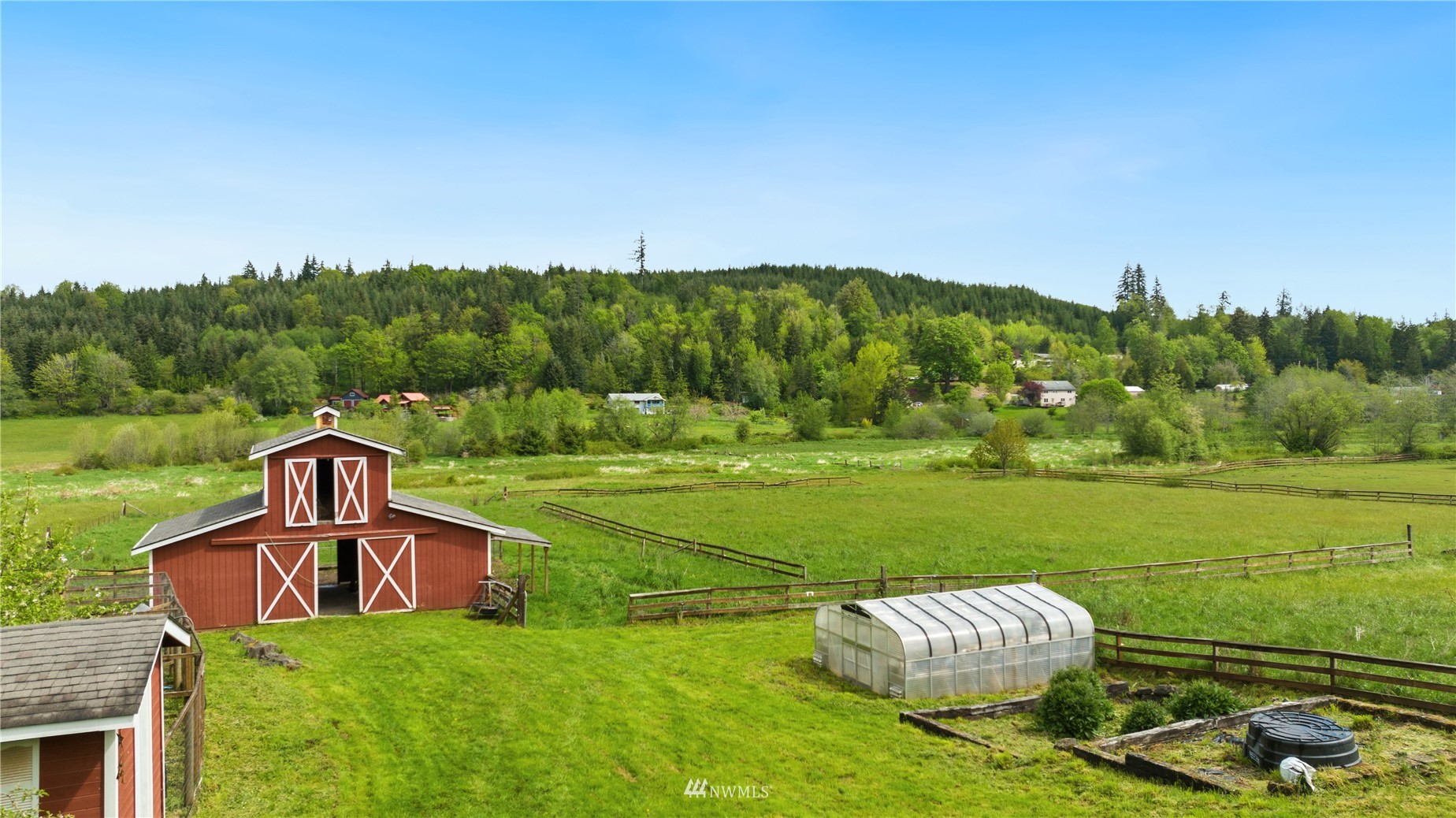 300 West Elk Ridge Road Shelton, WA 98584 - Photo 3 of 40 a view of a golf course with a garden
