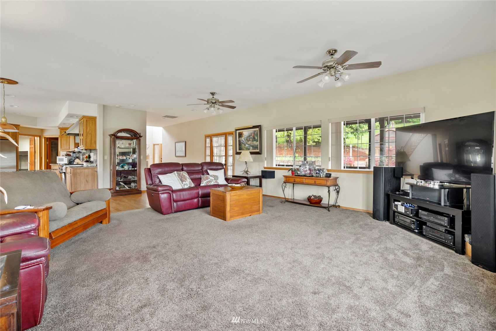300 West Elk Ridge Road Shelton, WA 98584 - Photo 8 of 40 a living room with furniture and a flat screen tv