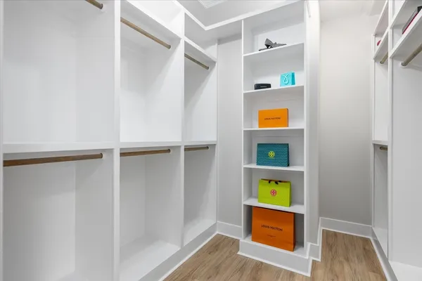 a view of an entryway with wooden floor and windows