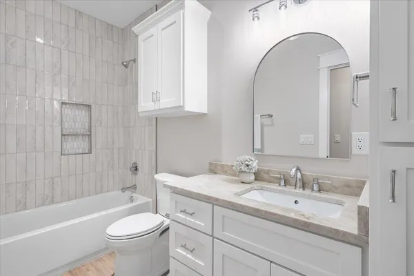 a bathroom with a sink a toilet and a bathtub