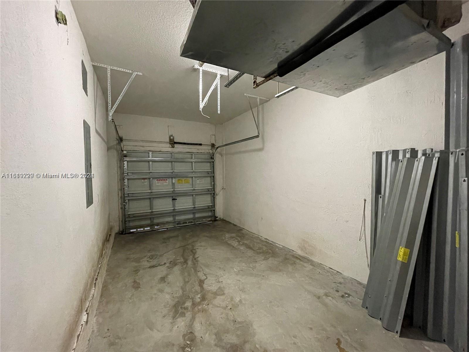 2133 Northeast 7th Street, Unit 2133 Homestead, FL 33033 - Photo 12 of 28 a view of a garage
