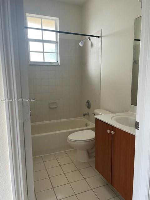 2133 Northeast 7th Street, Unit 2133 Homestead, FL 33033 - Photo 14 of 28 a bathroom with a sink a toilet and shower