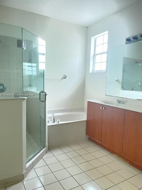 2133 Northeast 7th Street, Unit 2133 Homestead, FL 33033 - Photo 17 of 28 a bathroom with a bathtub and a sink