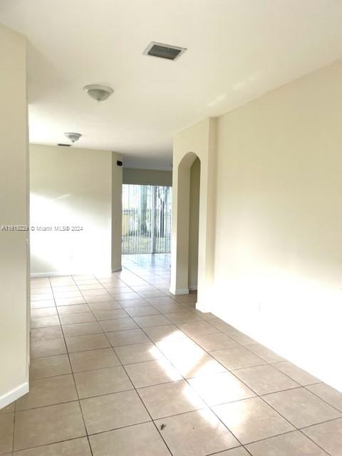 2133 Northeast 7th Street, Unit 2133 Homestead, FL 33033 - Photo 2 of 28 a view of an empty room and window