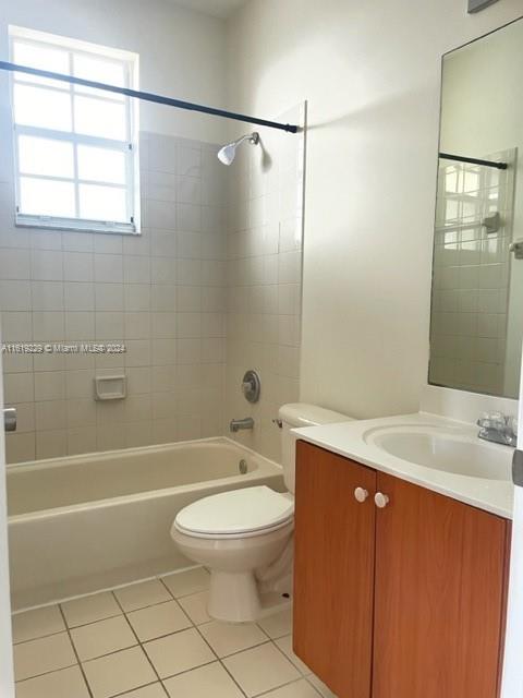 2133 Northeast 7th Street, Unit 2133 Homestead, FL 33033 - Photo 21 of 28 a bathroom with a sink a toilet and shower